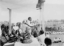 Description: https://upload.wikimedia.org/wikipedia/commons/thumb/f/fc/Dr._Ambedkar_delivering_speech_during_conversion.jpg/220px-Dr._Ambedkar_delivering_speech_during_conversion.jpg